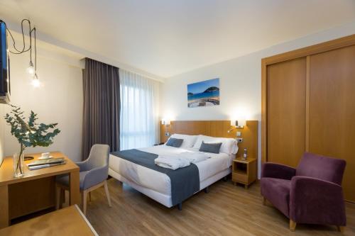 Ένα ή περισσότερα κρεβάτια σε δωμάτιο στο Hotel Palacio de Aiete
