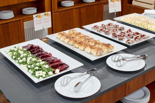 a buffet with different types of food on a table at Hotel Srní a Depandance in Srní