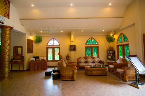 a large living room with couches and chairs at The Hotel Umbra Bagan in Bagan