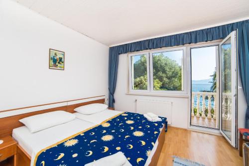 Postel nebo postele na pokoji v ubytování Villa Gomila