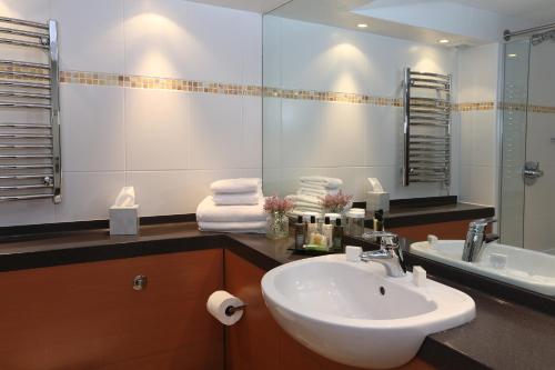 a bathroom with a sink and a mirror at Best Western Plus Dunfermline Crossford Keavil House Hotel in Dunfermline