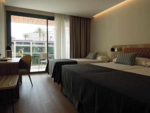 Letto o letti in una camera di Hotel Presidente 4 sup