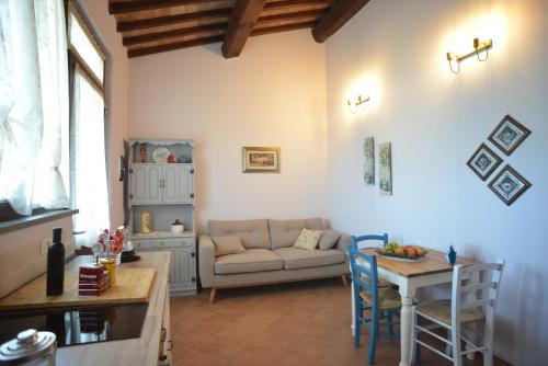 a living room with a couch and a table at Agriturismo La Fonte in Grosseto