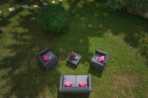 an overhead view of three couches with pillows on a lawn at Villa Palma Karojba in Karojba