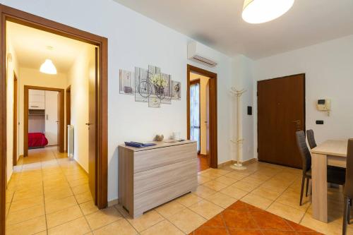 a room with a kitchen and a dining room at Sweet Home La Ville in Caserta