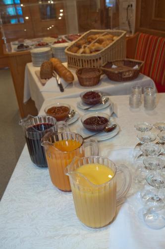 a table topped with cups and plates of food at Hotel Zur Krone in Beilngries