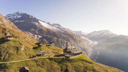 a mountain with houses on the side of it at Farfalla in Blatten bei Naters