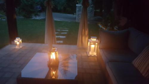 a lit up patio with candles and a couch at Studio apartment Cami - Cottage with a soul in Gračišće
