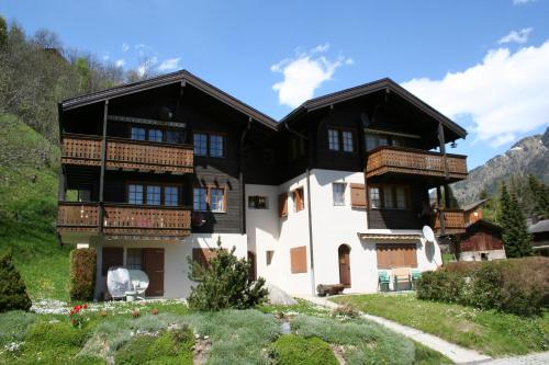 a large house with balconies on a mountain at Halta B in Blatten bei Naters