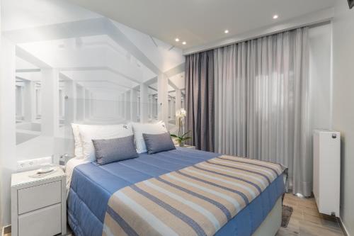 Ένα ή περισσότερα κρεβάτια σε δωμάτιο στο Odysseus Villa
