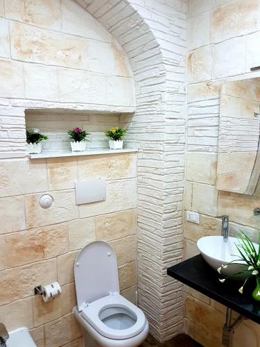 a bathroom with a toilet and a sink at Room n.22 in Taranto