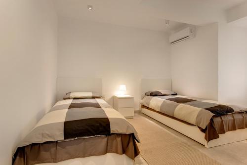 Postel nebo postele na pokoji v ubytování Marvellous Seafront Apartment