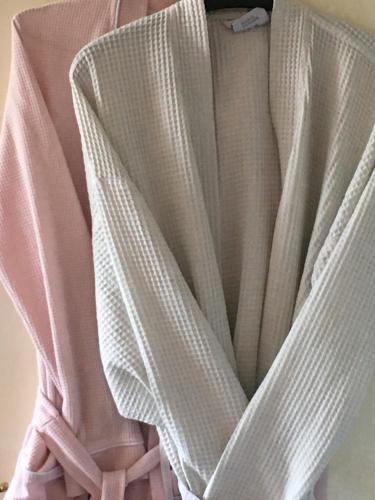 a pink dress with a pink bow on it at Love & Peace in Orpington