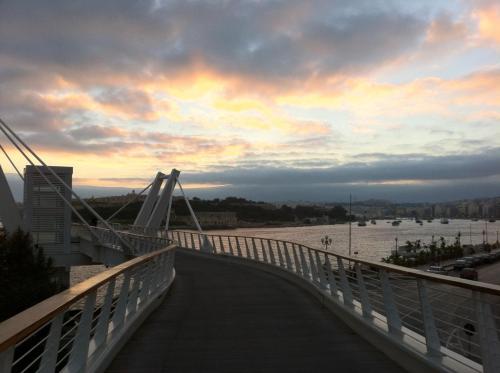 a bridge over a river with a cloudy sky at Modern 2BR Sliema Apartment in Sliema