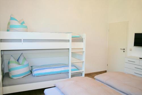 Postel nebo postele na pokoji v ubytování Gästehaus Gaumenflug am See