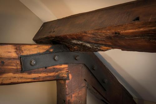a close up of a wooden door with a metal latch at The Resident Liverpool in Liverpool