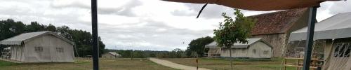 two pictures of a building with a tree on it at Camping Parc de la Brenne in Lignac