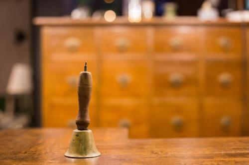 a knife sitting on top of a wooden table at Narra House Sukhumvit58 in Bangkok
