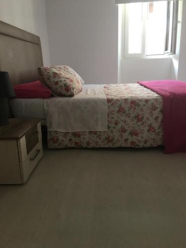 a bedroom with a bed and a window at Castro Sun And Beach in Castro-Urdiales