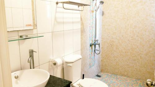 Kylpyhuone majoituspaikassa Nandian Homestay