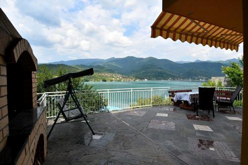 a camera on a balcony with a view of a lake at Keep calm Lake edition in Konjic