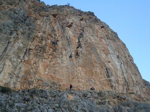 two people standing in front of a rocky mountain at Leonidio Climb2red home in Leonidion
