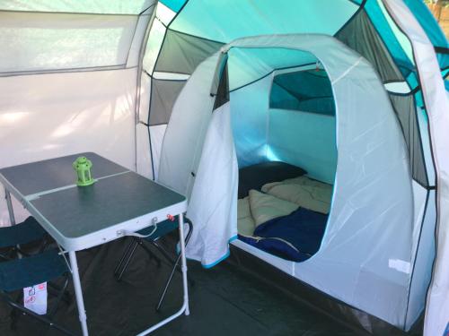 a tent with a table in front of it at Capalbio Campeggio Rurale in Capalbio