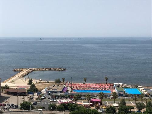 a view of a resort with a pool and a beach at B&B Seataly by W Signature Experiences in Civitavecchia