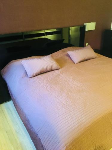 Łóżko lub łóżka w pokoju w obiekcie Apartament Ala