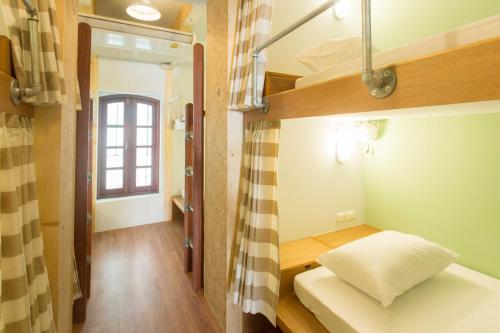 Ένα ή περισσότερα κρεβάτια σε δωμάτιο στο Barn & Bed Hostel