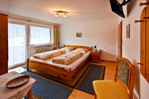 a bedroom with a large bed in a room at Haus St. Christoph in Mayrhofen
