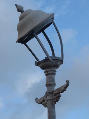 an old street light with a blue sky in the background at The Iverna in Eastbourne