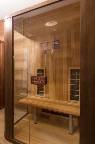 a glass display case in a room with a box at Hotel Lirak in Tetovo