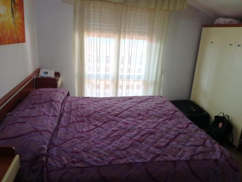 Ένα ή περισσότερα κρεβάτια σε δωμάτιο στο Hotel Michela