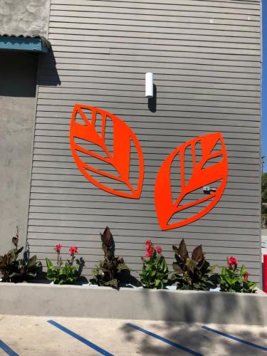 a building with orange graphics on the side of it at Riverleaf Inn Mission Valley in San Diego