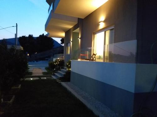 a house with the sun shining through a window at Rustemi in Sarandë