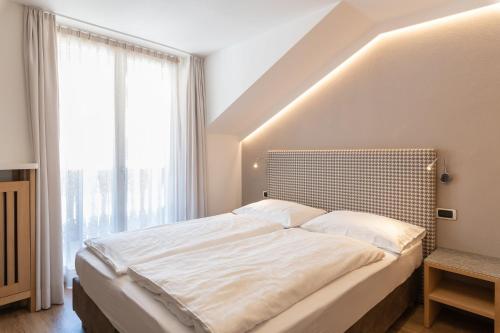 Ένα ή περισσότερα κρεβάτια σε δωμάτιο στο Villa Aurelia