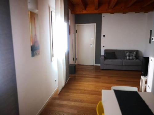 a living room with a couch and a table at Villa Zen 2 in Padova