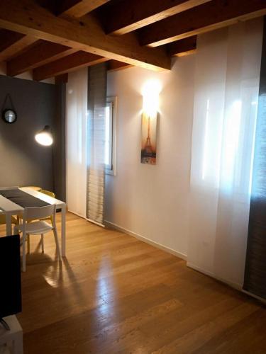 a living room with a table and a dining room at Villa Zen 2 in Padova