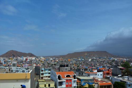 a view of a city with mountains in the background at Sol Hotel in Praia