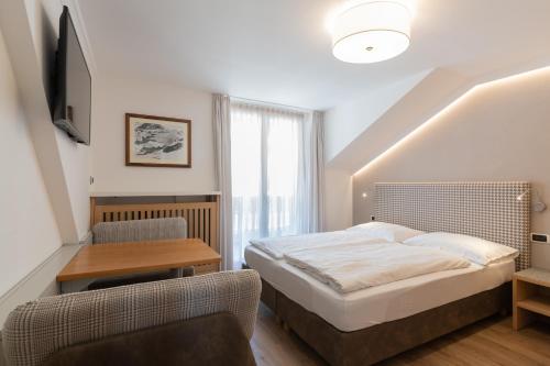 Ένα ή περισσότερα κρεβάτια σε δωμάτιο στο Villa Aurelia