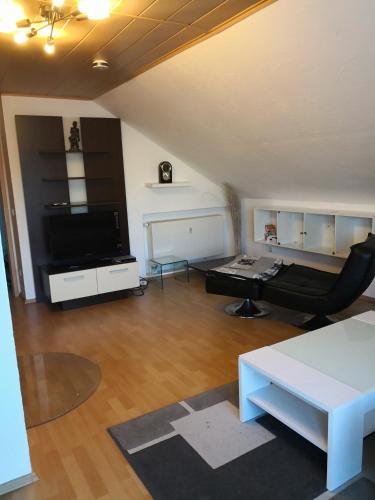 a living room with a couch and a table at Ferienwohnung Schmeisser in Kirchenpingarten