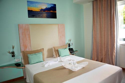 Postel nebo postele na pokoji v ubytování Sol Hotel
