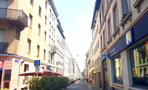 a city street with buildings on the side of the road at Naeva Feng Shui in Strasbourg