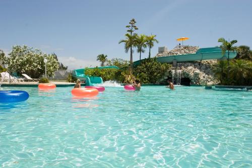 a group of people in a swimming pool at The Marlin at Taino Beach Resort in Freeport