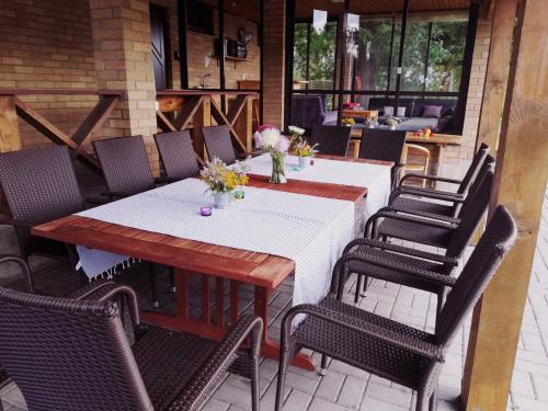 a table and chairs on a patio at Raudonkalnis in Mankiškiai