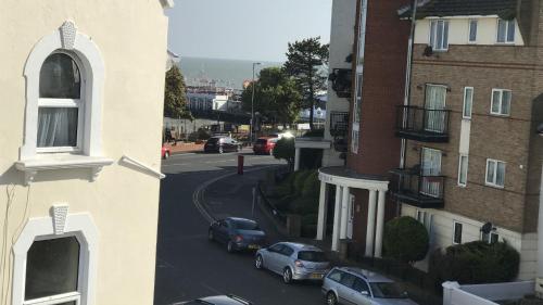 a view of a city street with cars parked on the road at Greyfriars in Clacton-on-Sea