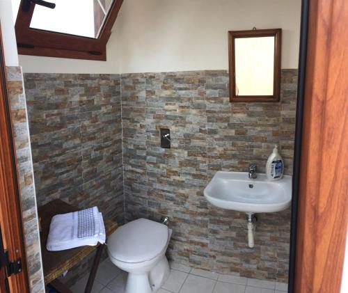 a bathroom with a sink and a toilet at Villa Santa Venera in Marsala