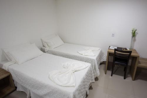 Postel nebo postele na pokoji v ubytování New Concept Hotel