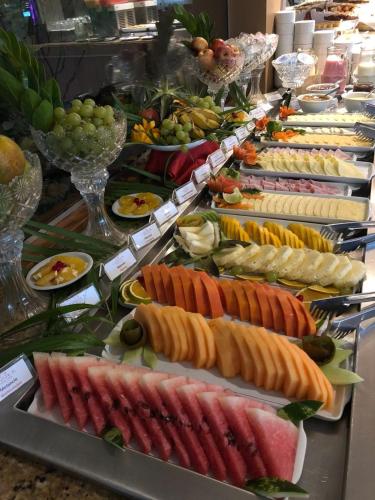 a buffet line with many different types of food at Garbos Trade Hotel in Mossoró